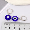Silver Tone Blue Glass Evil Eye Huggie Drop Earrings view 2