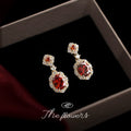Gold Tone Red Oval Stone Clear Halo Drop Stud Earrings view 1
