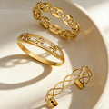 Hollow Link Clasp and Open Twist Bangles Gold Steel view 1