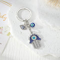 Blue Evil Eye Hamsa Hand Metal Keychains in Four Designs view 3