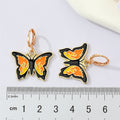 Gold Tone Black Enamel Butterfly Huggie Drop Earrings in Two Colors view 4