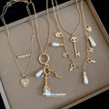Gold Tone Layered Charm Necklaces With Decorative Accents view 4