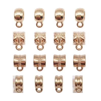Gold-tone assorted shape charms arranged on a light background
