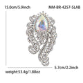 Ornate Teardrop Crystal Brooch with Filigree Scrolls view 12
