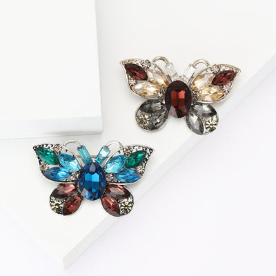 Faceted Gem Butterfly Brooch shown against a white display background