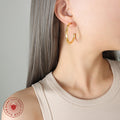 Large Twisted Flat Circular Hoop Earrings Gold And Steel Tone view 3