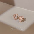 Rose Gold Five Petal Flower Huggie Hoop Earrings Pair view 2