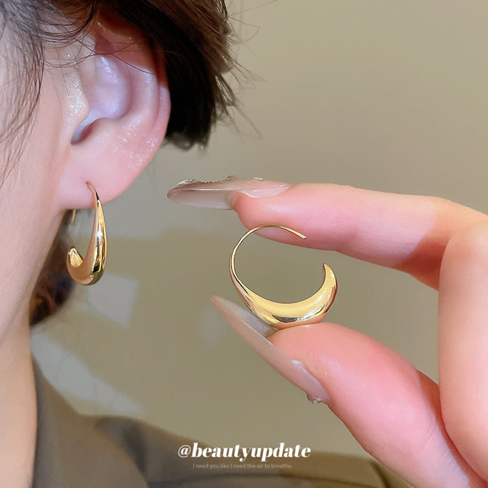 Gold Tone Sculpted Crescent Hook Earrings with Detailed Finish