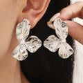 Hammered Three-Petal Flower Stud Earrings Shell Bead Center view 4