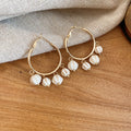 Gold Hoop Earrings with Four Pictured Bead and Sequin Designs view 1