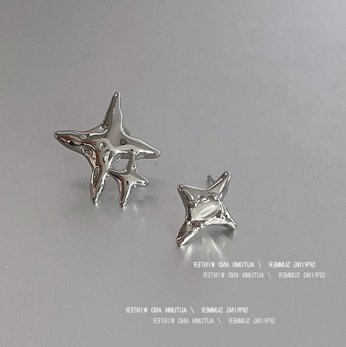 Silver Asymmetric Star Stud Earrings Cat Eye Accent Pair