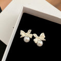 Silver Tone Bow and White Pearl Look Small Stud Earrings view 4