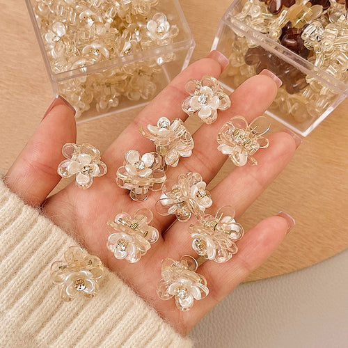 champagne-clear mini claw with layered translucent flower petals shown in the first close product view
