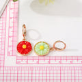 Gold Tone Round Daisy Resin Huggie Drop Earrings in Six Colors view 5