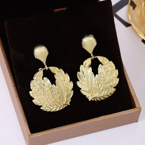 Second supplied view of ornate leaf wreath earrings