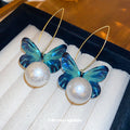 Blue Butterfly Hoop Drop Earrings with Round Faux Pearl Accent view 1