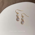 Gold Tone White Pearl And Clear Oval Stone Hook Earrings view 1
