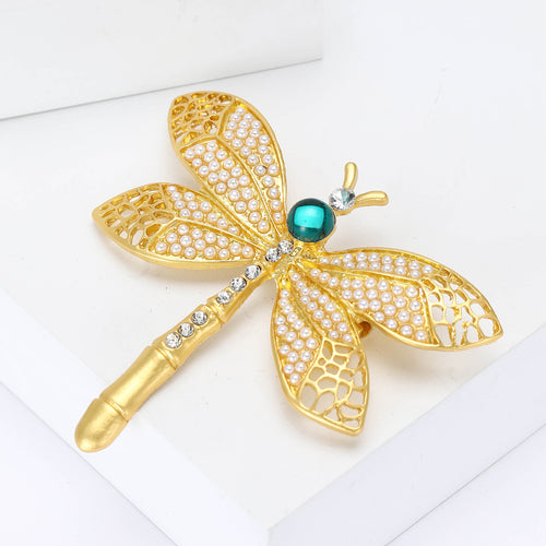 Gold dragonfly brooch angled close-up pearl wings teal bead