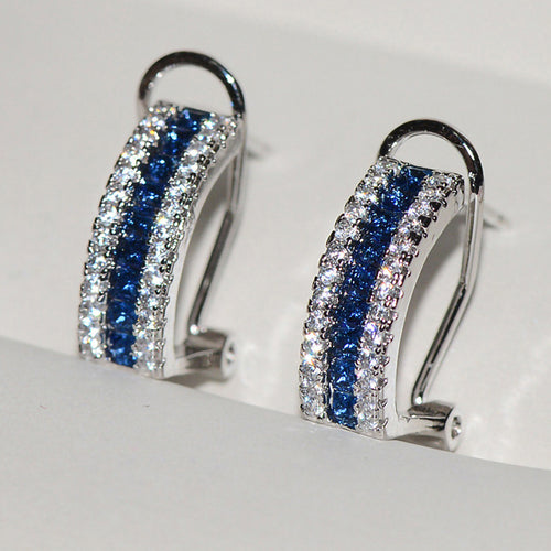 Front view of the blue triple-row curved earrings