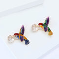 Colorful Hummingbird Brooch Carrying a White Flower view 3