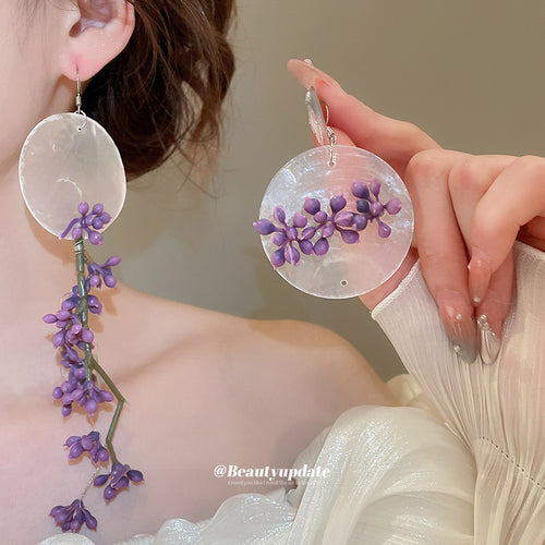 不对称紫花圆片流苏耳环 shown in product image 1, with the pictured color, shape, and construction details