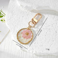 Irregular Gold Frame Dried Flower Resin Keychains Three Styles view 4