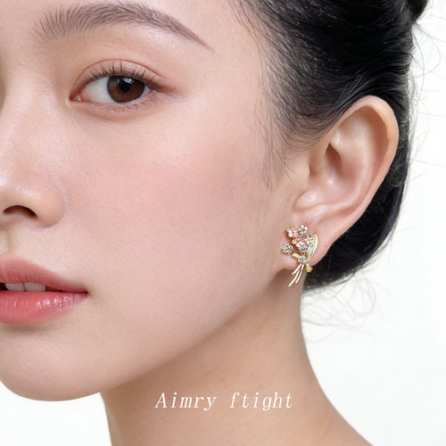 Pink enamel bouquet stud earring worn on ear portrait