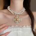Multistrand Shell Bead and Ornate Cross Pendant Necklace view 3