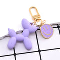 Gold Tone Balloon Dog and Smile Disc Clip Keychains view 3