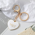 Gold Tone Black and White MR and MRS Heart Keychains view 3