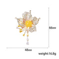 Flower Tassel Brooch in Metal with Layered Crystal Petals, Round Center, and Dangling Drop view 5