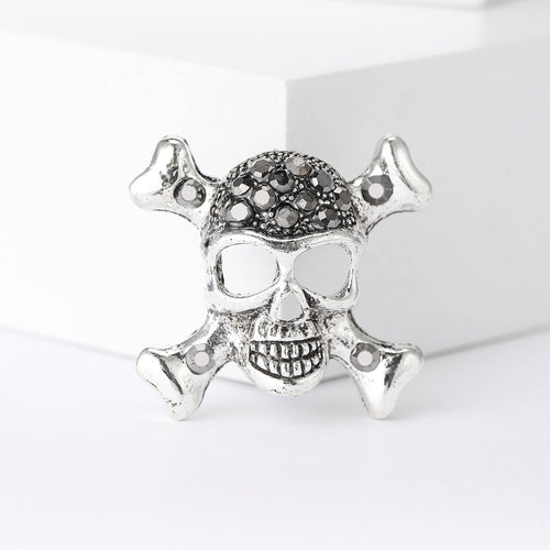 Silver skull brooch dark rhinestone forehead close front view