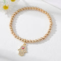 Gold Tone Beaded Teardrop Evil Eye and Hamsa Charm Bracelets view 9