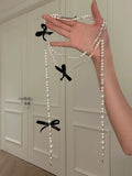 Long Pearl Tassel Necklace With Crystal Bow Accents view 6