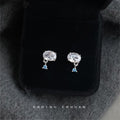 Silver Tone Large Clear Oval Stone Small Blue Stone Stud Earrings view 1