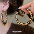 Black and White Wrapped Hoop Earrings with Gold Tone Edges view 1
