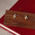Gold Mini Leaf Sprig Stud Earrings Clear Crystal Pave view 4