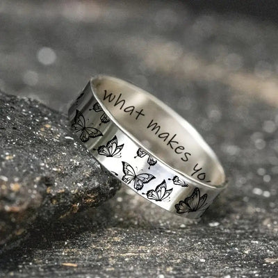 Silver butterfly band ring with what makes you engraving on stone