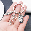 Two Silver Tone Syringe Stethoscope and Heart Keychains view 3