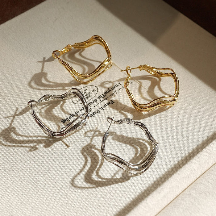 Irregular Wavy Hoop Earrings In Gold And Silver Tones