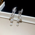 Pearl Cluster Floral Dangle Clip On Earrings With Polished Metal Details view 6