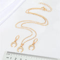 Gold Tone Crystal Double Horn Necklace and Huggie Earring Options view 2