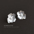 Silver-Tone Textured Flower Stud Earrings Matte Finish view 1