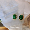 Green Oval Cabochon Stud Earrings Gold Scalloped Frame view 1