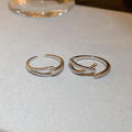 Two Silver Tone Open Rings With Overlapping Crystal Bands view 1