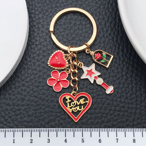 Alternate arrangement of the red rose heart wand and lipstick metal keychain showing its hardware and charm details