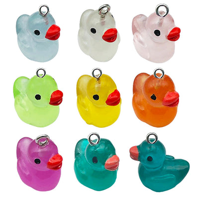 Multicolor assorted shape charms arranged on a light background