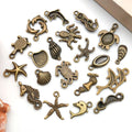Gold-Tone Starfish and Shell Shell Charms with 26 Listed Options view 4
