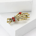 Skeleton Hand Brooch With Jeweled Ring and Ornate Cuff view 3