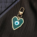 Gold Tone Swirled Heart Evil Eye Clip Keychains in Five Colors view 7